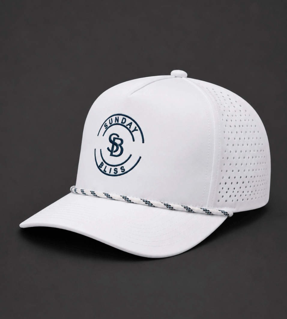 Sunday Bliss Classic Golf Cap in white with navy logo and unique side design features.